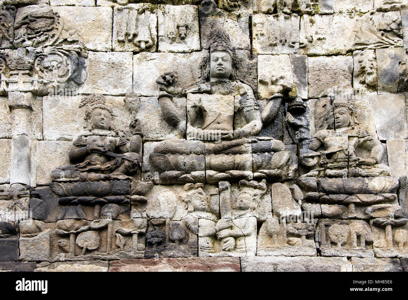 Bas-relief in stone Buddhist divinities Candi Mendut Temple 9th century near Borabadur Central Java Indonesia Stock Photo