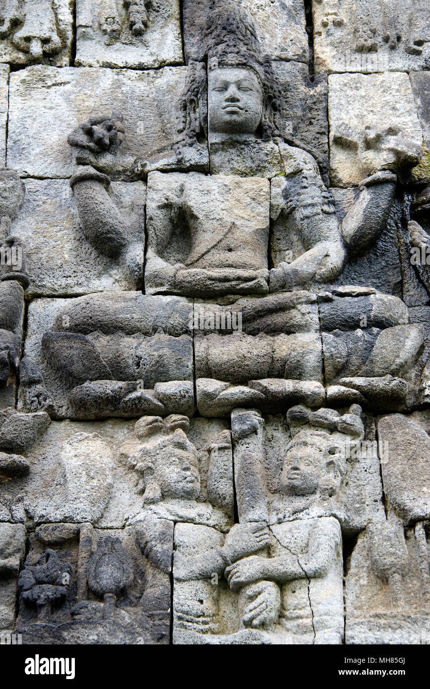 Buddhist bas-relief in stone  Candi Mendut Temple 9th century near Borabadur Central Java Indonesia Stock Photo