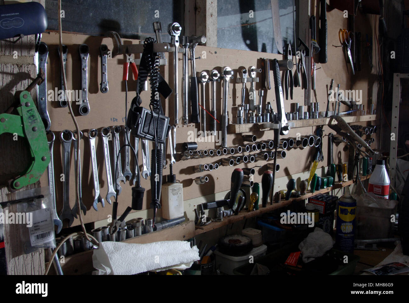 Tools Hanging Neatly Organised On The Wall Of A Garage Workshop