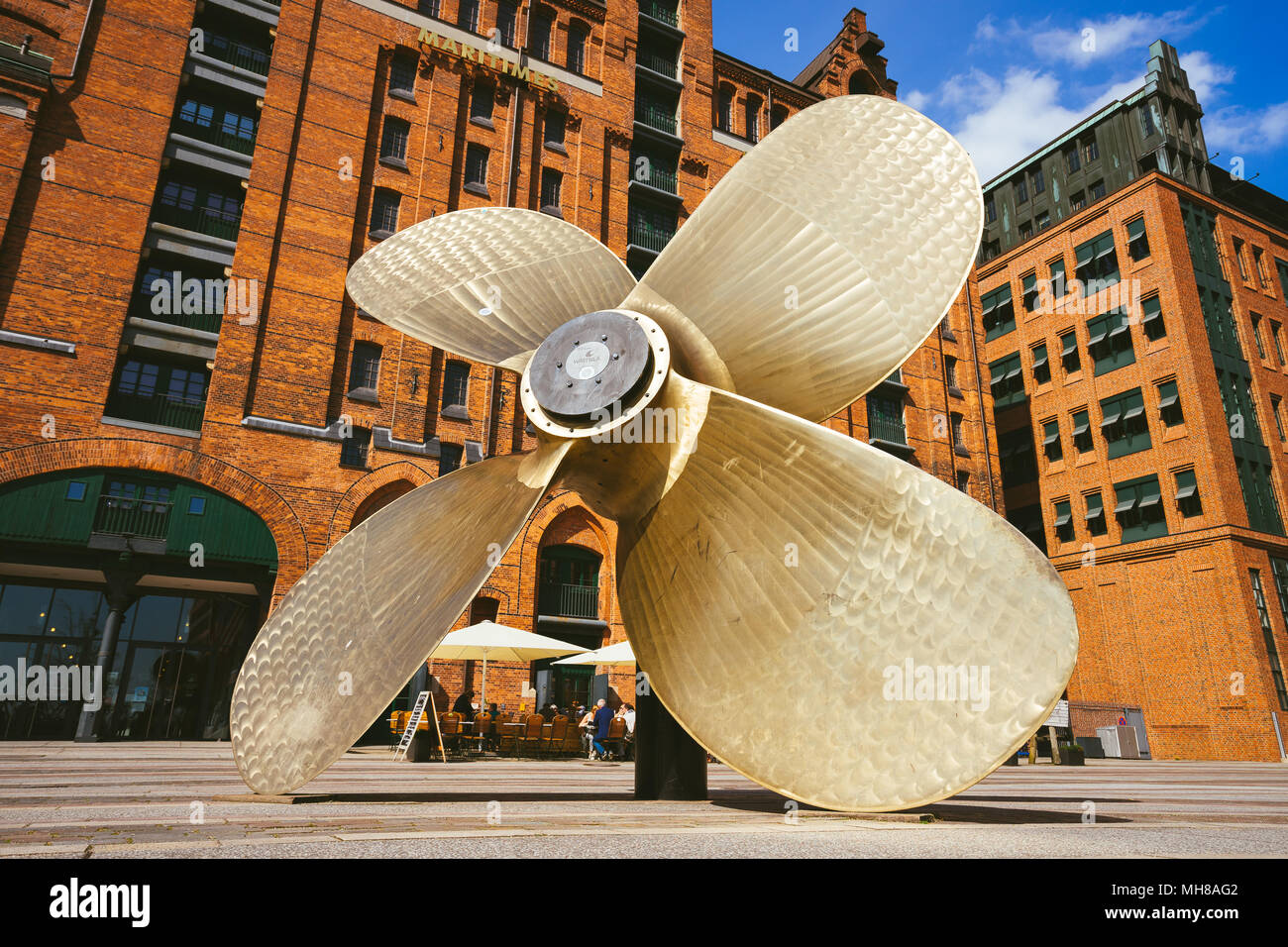 Hamburg, Germany - May 17, 2018: Giant four-blade ship propeller in front of the International Maritime Museum in Hamburg's Speicherstadt district. Stock Photo
