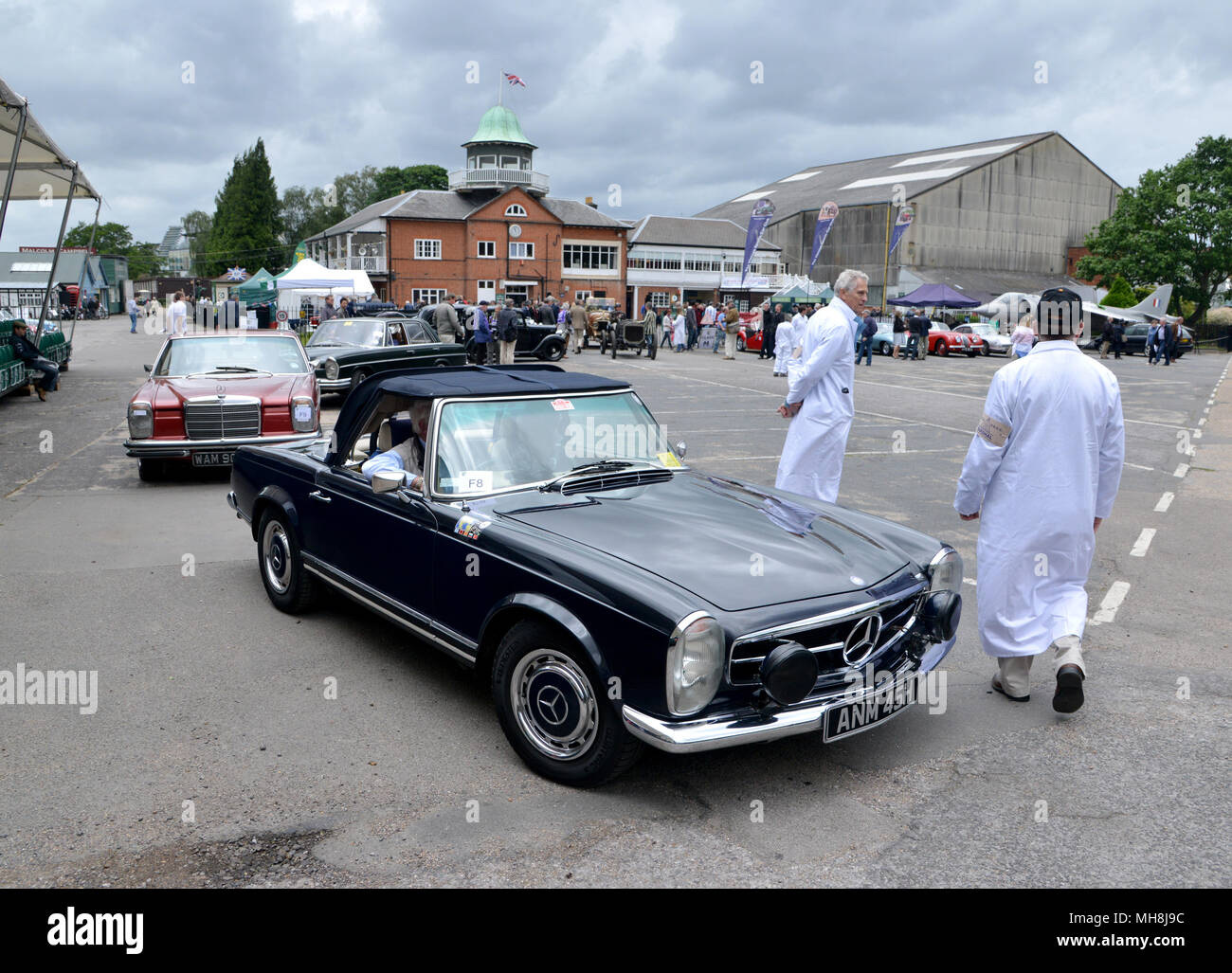 Classic cars queuing to go up the hill climb at Brooklands, Surrey, UK Stock Photo