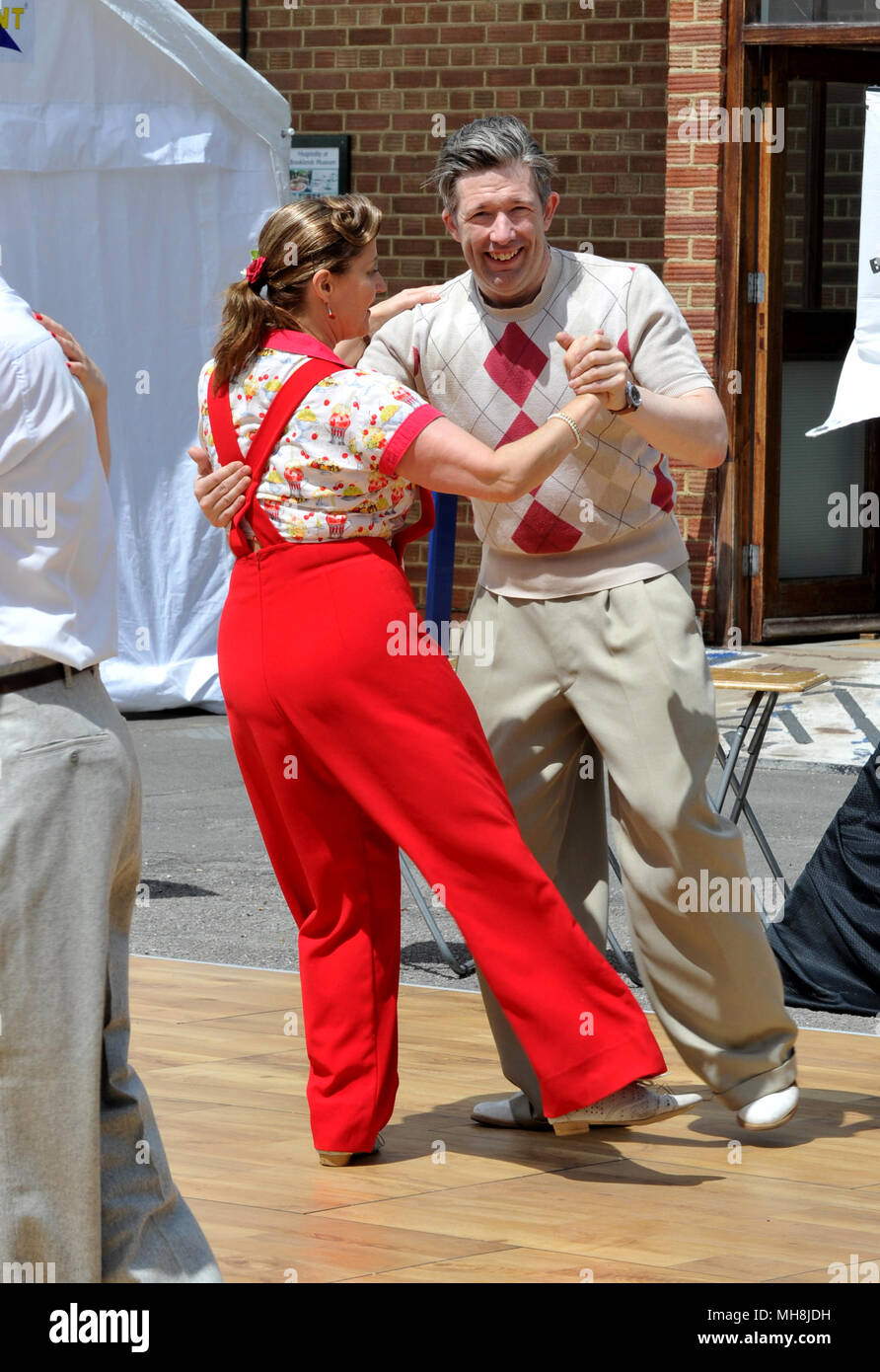 swing dancers in 1930s or 40s clothes at Brooklands Double 12 Stock Photo