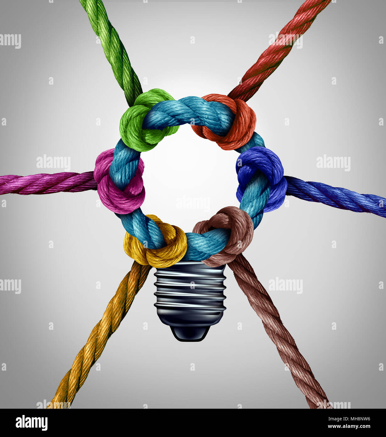 Central creativity concept as a group inspiration connection idea as diverse ropes tied together as a team symbol with 3D illustration elements. Stock Photo