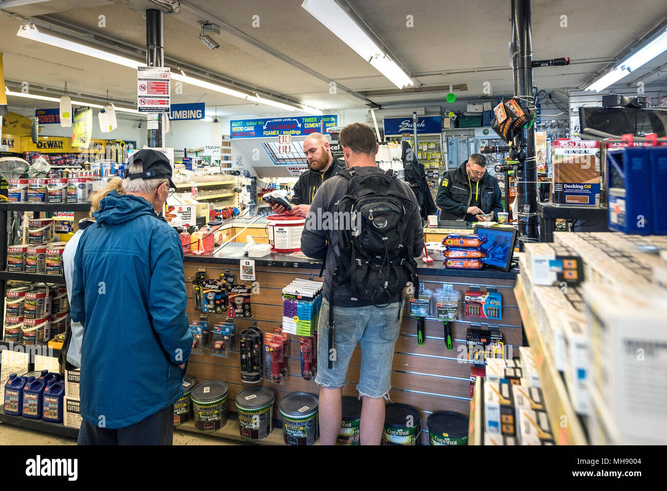 Customers being served in a DIY store. Stock Photo