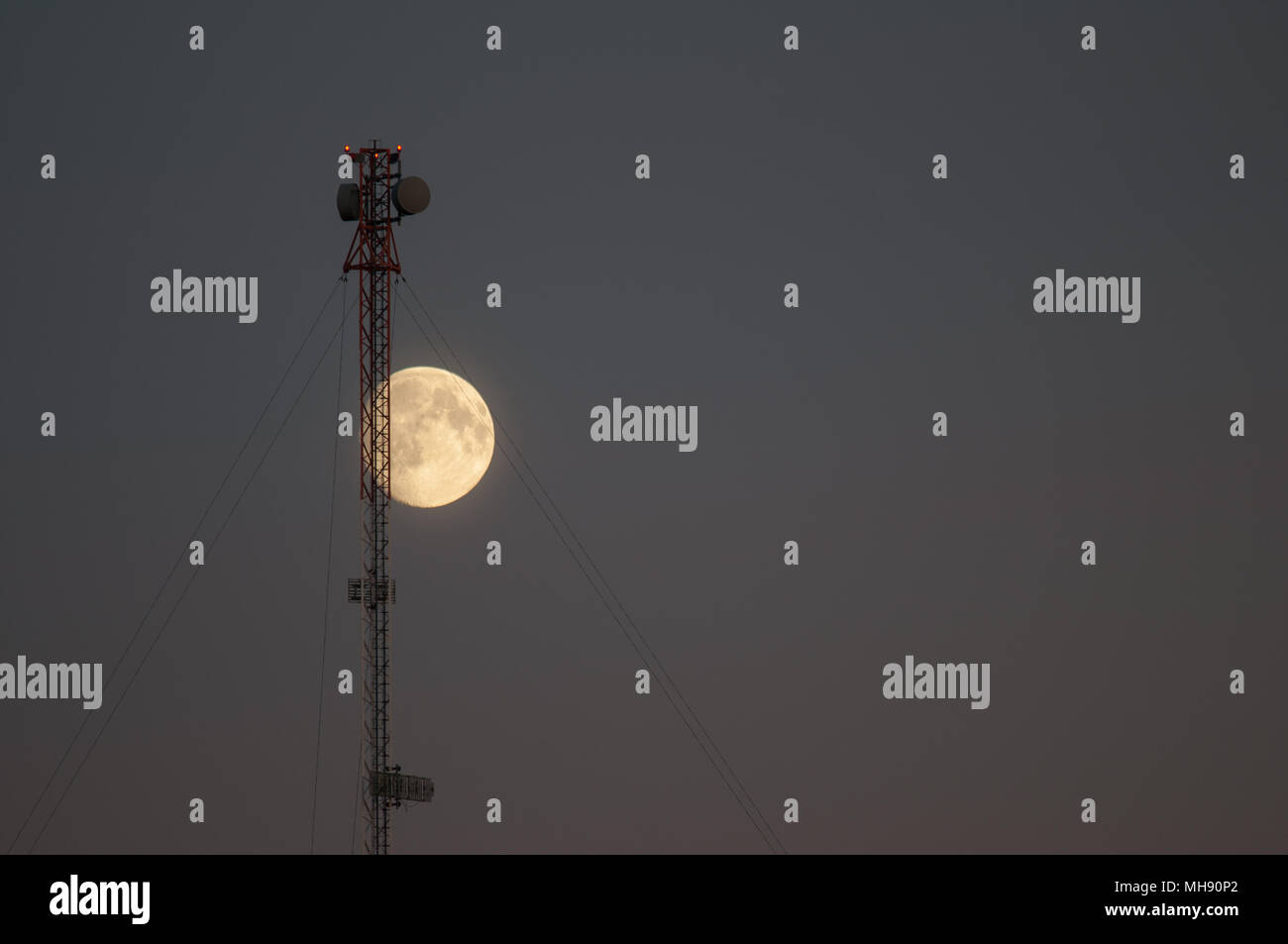 Moon and Communications tower Stock Photo