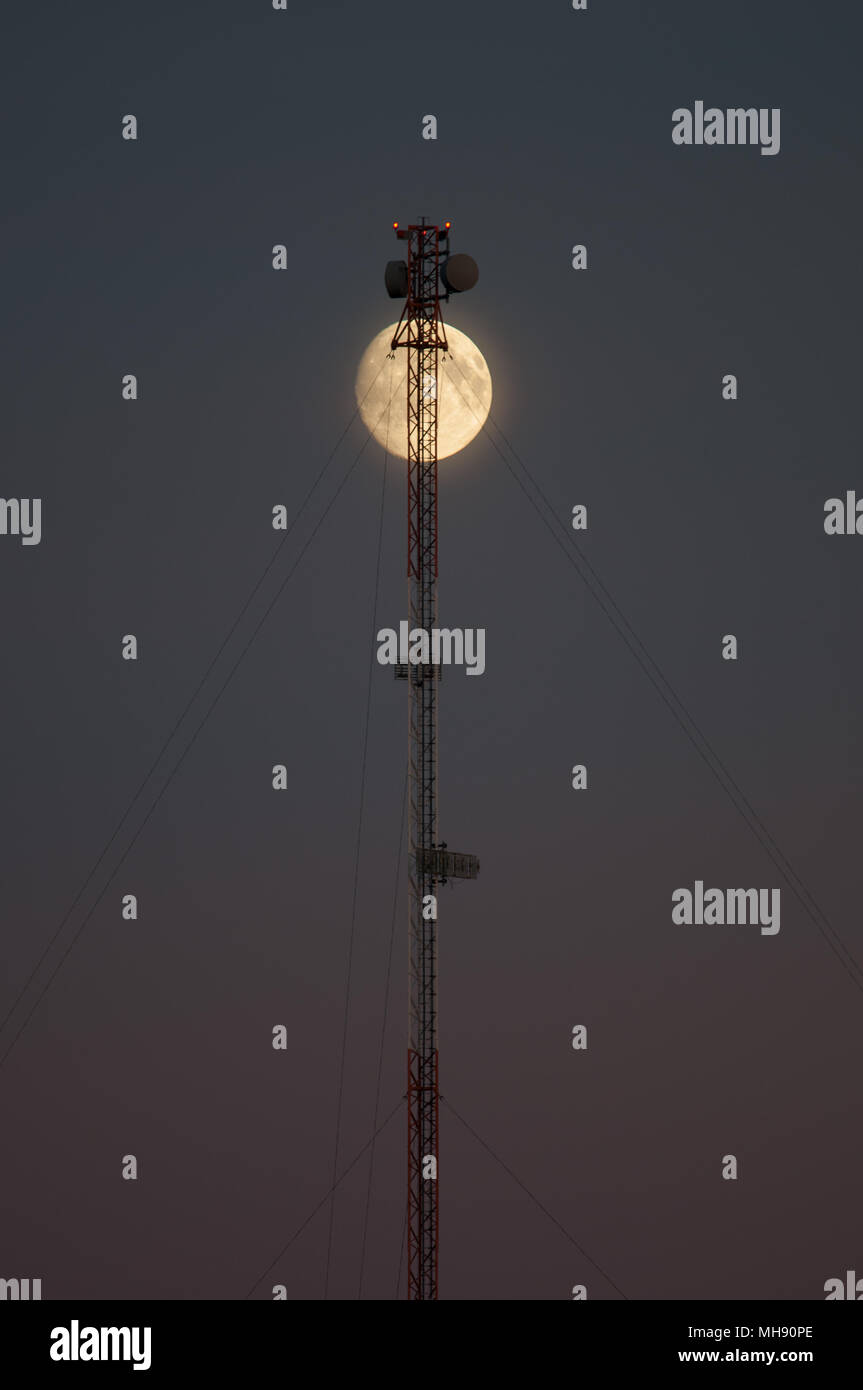 Moon and Communications tower Stock Photo