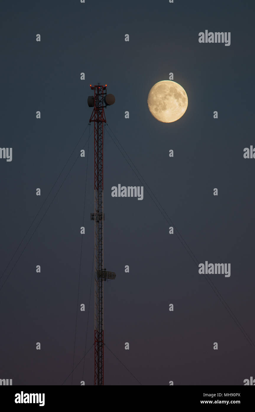 Moon and Communications tower Stock Photo