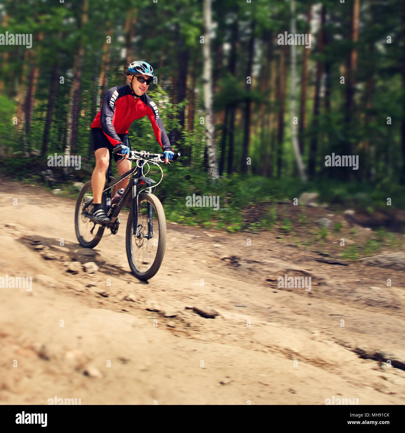 cyclist riding mountain bike Stock Photo - Alamy