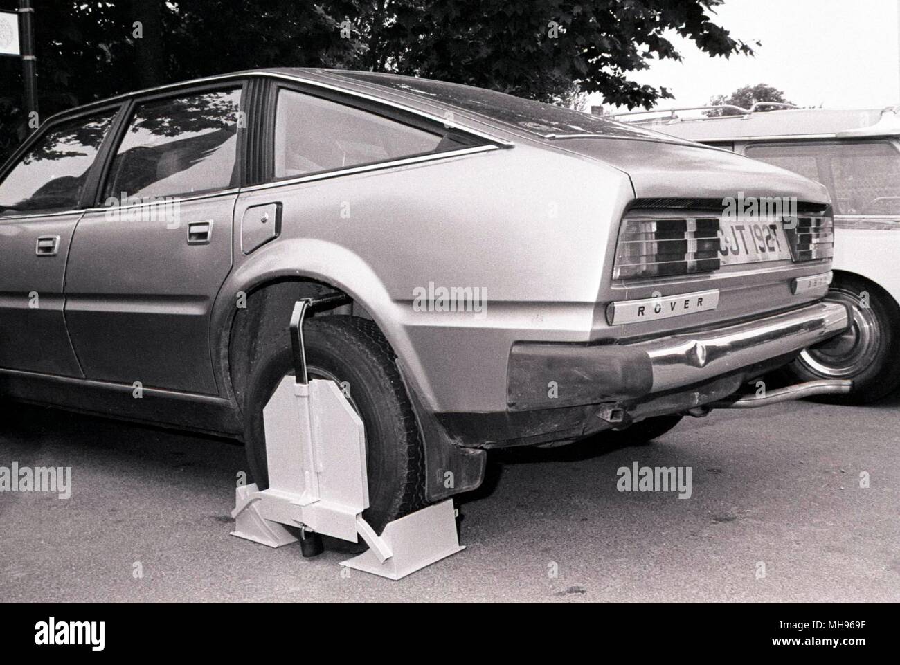 Wheel clamped Rover 3500 in Salisbury, Wiltshire UK. Circa 1990 Stock Photo