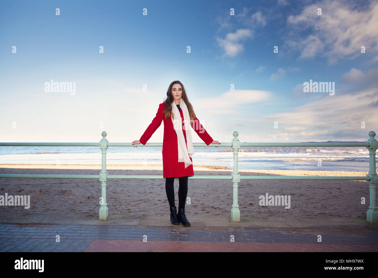 Woman at the beach, showing emotion and expression dealing with anxiety, grief, depression and mental health. Stock Photo