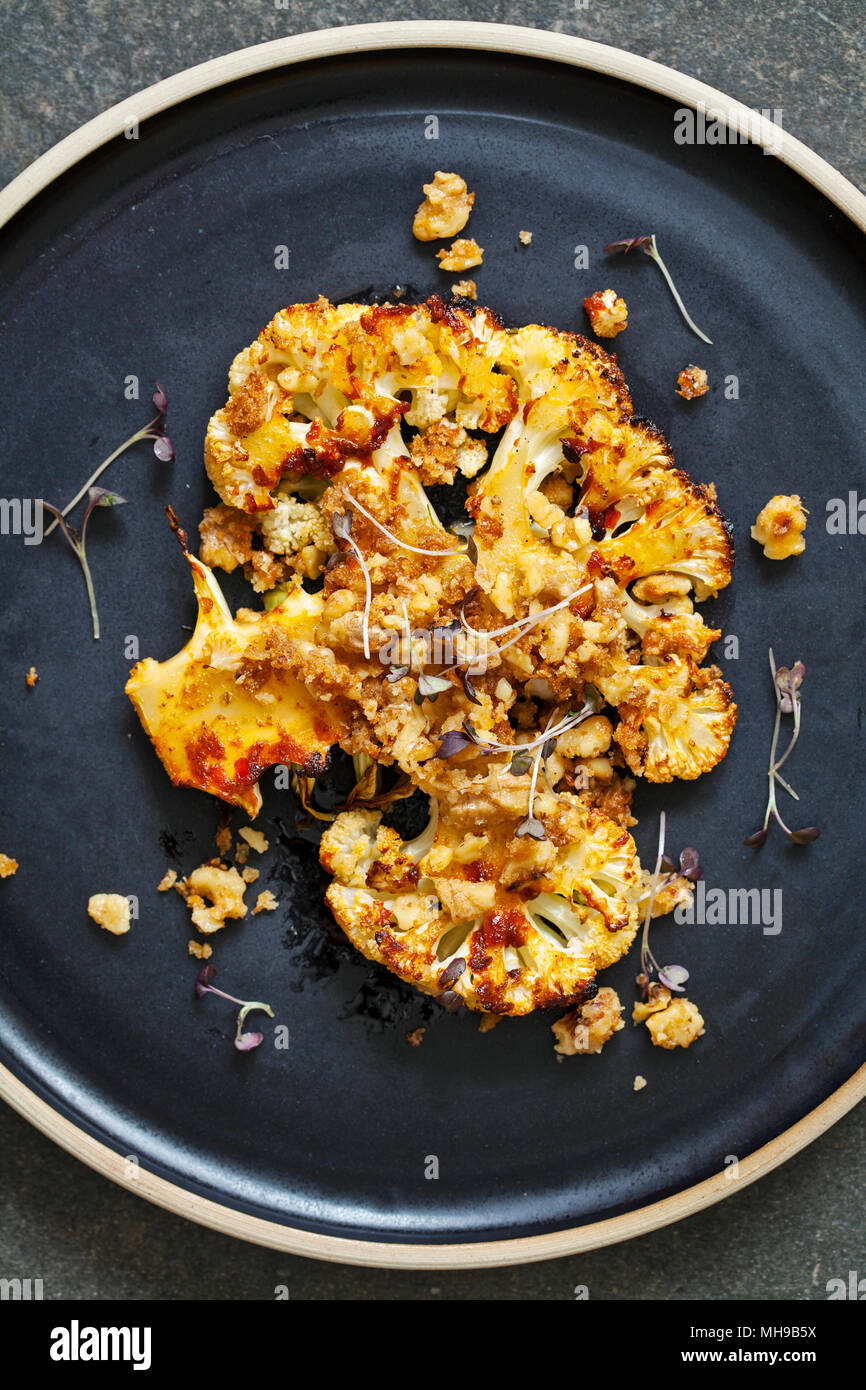 Cauliflower steak with harissa paste and walnuts Stock Photo Alamy
