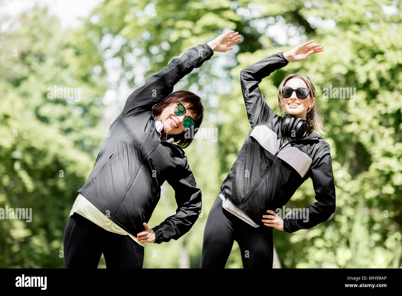 Two woman exercising in the park Stock Photo