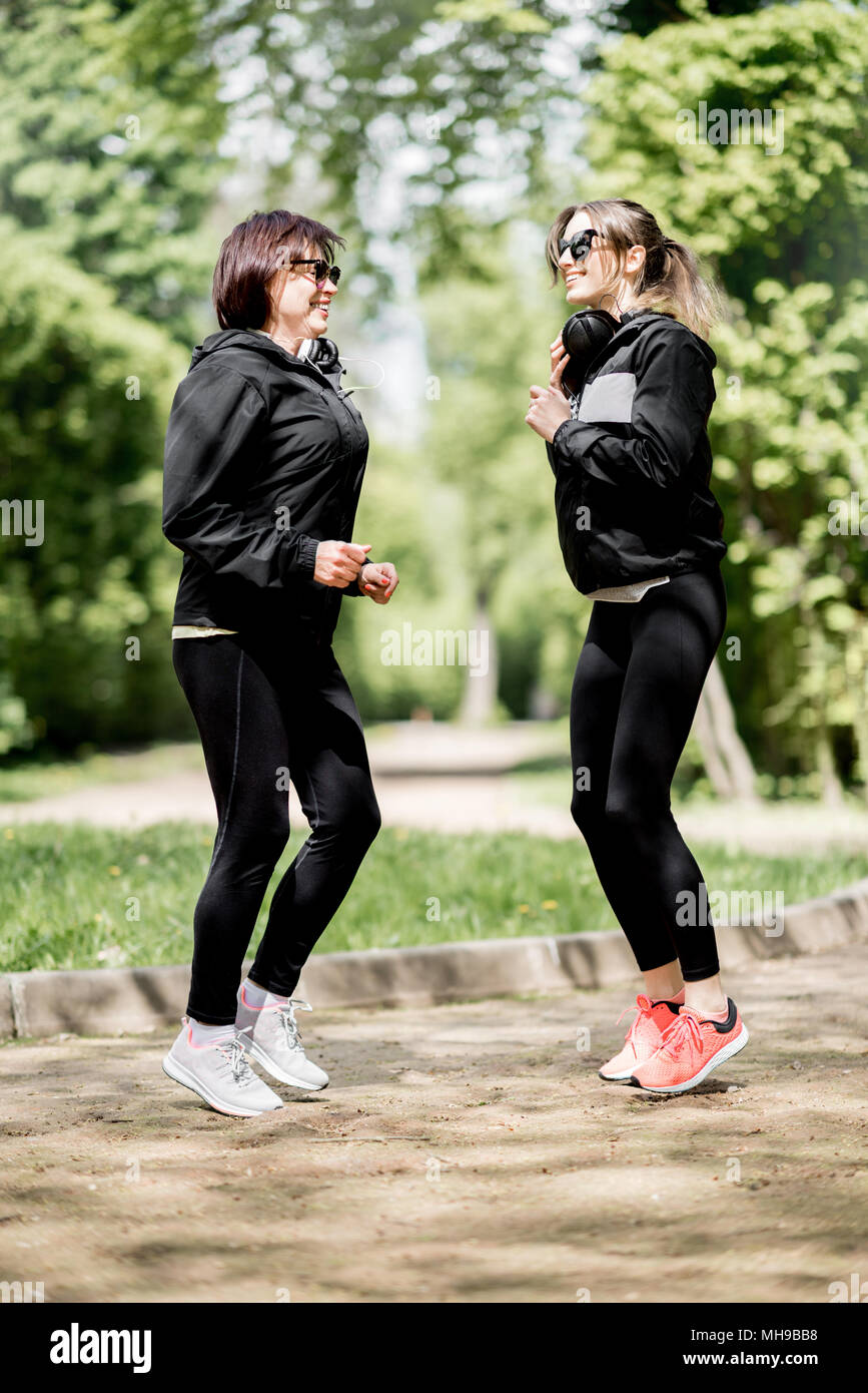 Two woman exercising in the park Stock Photo