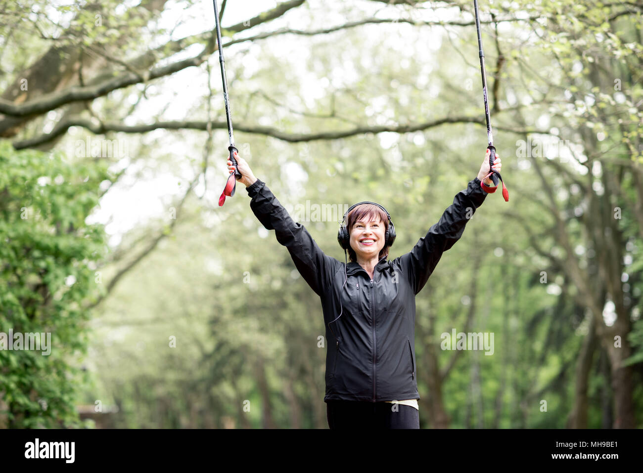 Old woman walking stick park hi-res stock photography and images - Alamy