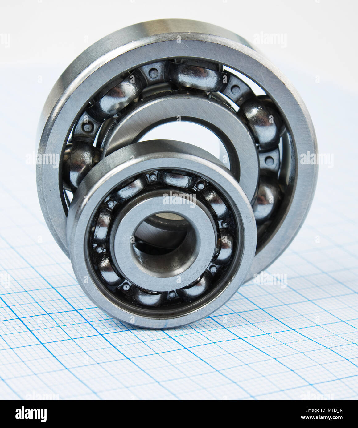 two bearings on graph paper Stock Photo Alamy