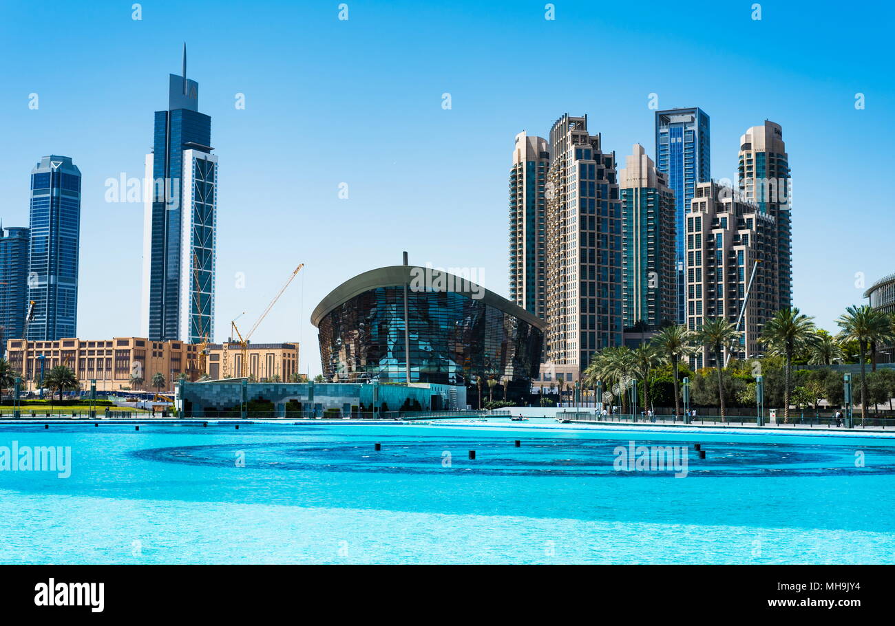 Dubai, United Arab Emirates - March 26, 2018: Dubai Opera and modern Dubai downtown skyscrapers view from Dubai mall at day time Stock Photo