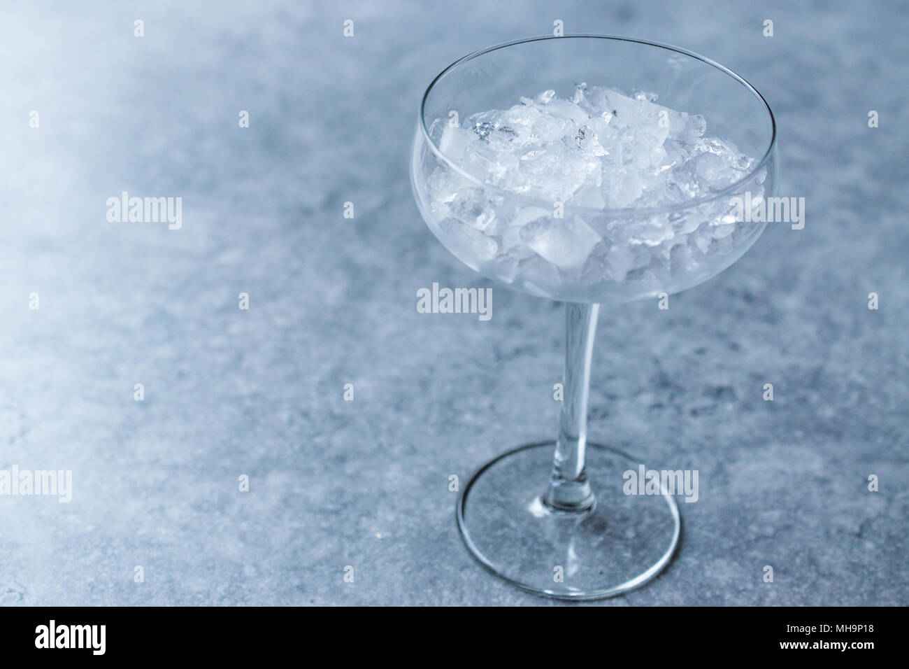 Crushed Ice In Cocktail Glass On Blue Surface. Beverage Concept. Stock  Photo, Picture and Royalty Free Image. Image 96557125.