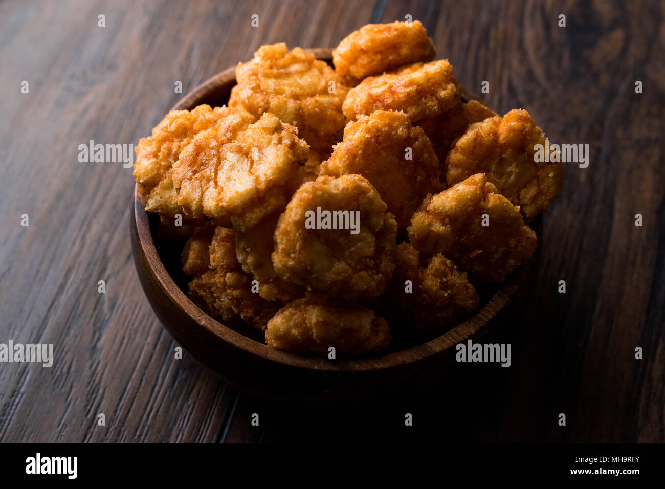 Thai Chilli Spicy Rice Crackers in wooden bowl. Organic Snacks. Stock Photo