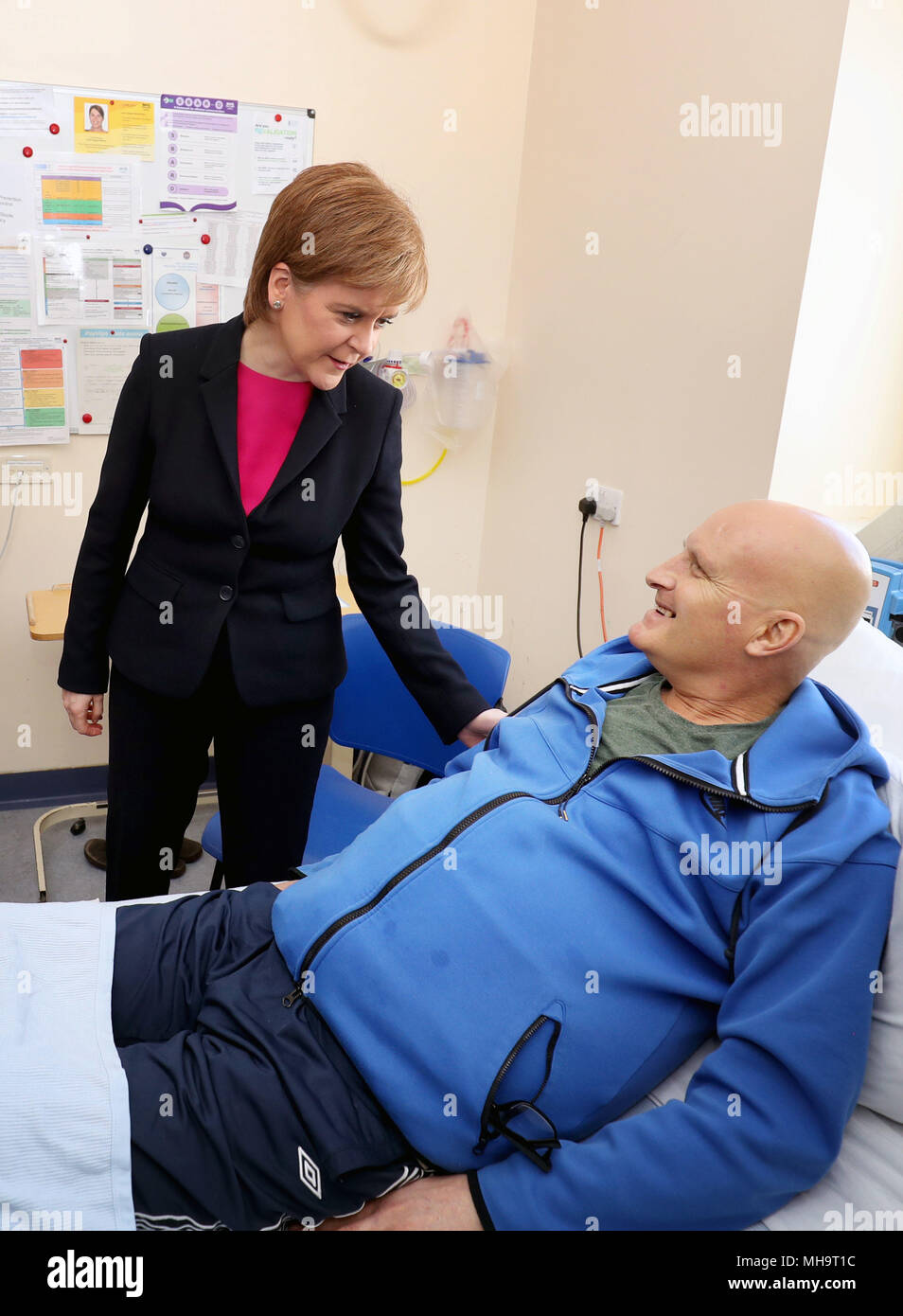 First Minister Nicola Sturgeon meets patient Thomas Crawford during a visit to the Edinburgh Royal Infirmary, as she marks the minimum unit pricing for alcohol coming into force and meet patients with chronic liver problems and specialist clinicians. Stock Photo