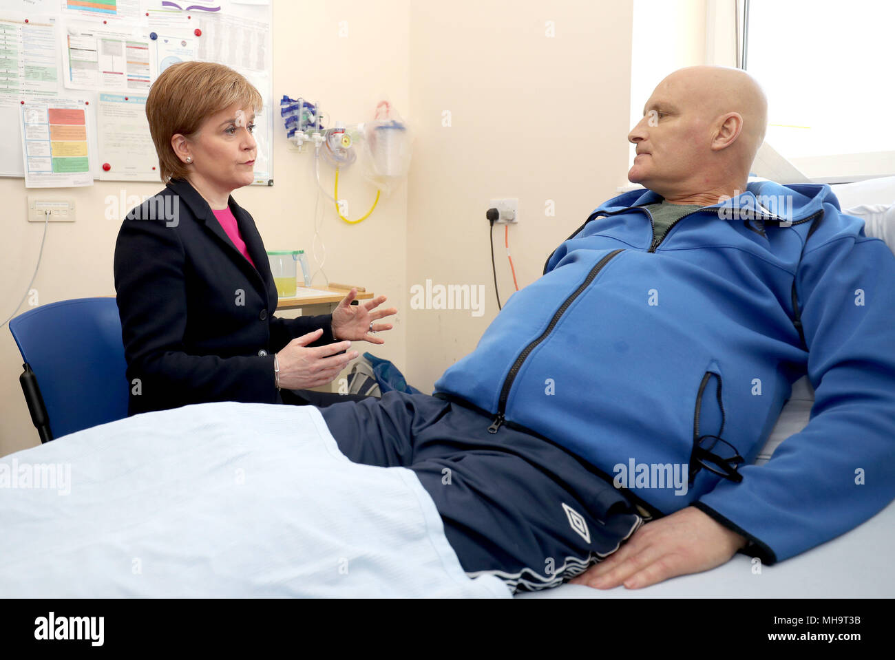 Embargoed to 0001 Tuesday May 01 First Minister Nicola Sturgeon meets patient Thomas Crawford during a visit to the Edinburgh Royal Infirmary, as she marks the minimum unit pricing for alcohol coming into force and meet patients with chronic liver problems and specialist clinicians. Stock Photo