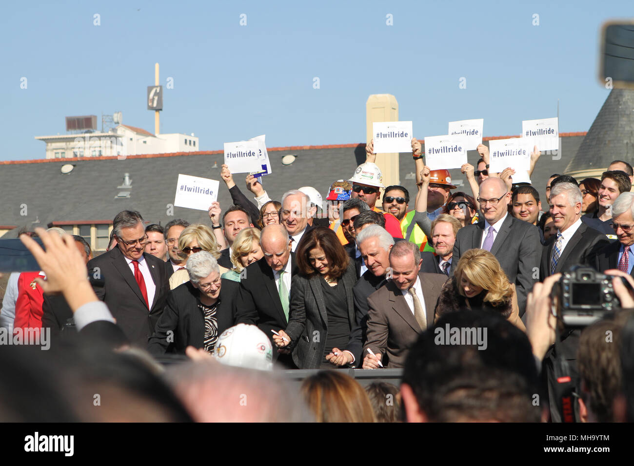 Governor Jerry Brown signs a piece of rail at the California High Speed Rail Groundbreaking Ceremony in Fresno Stock Photo