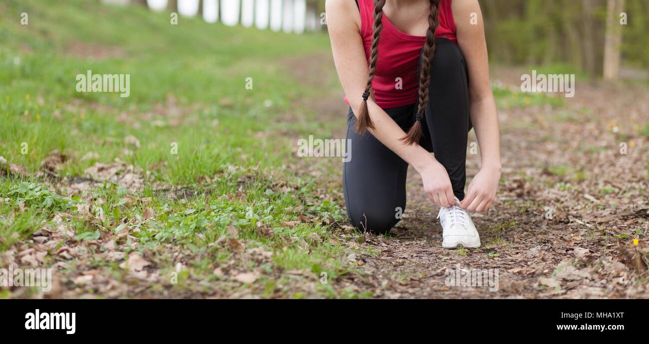 Young beautiful woman running on a trail Stock Photo - Alamy