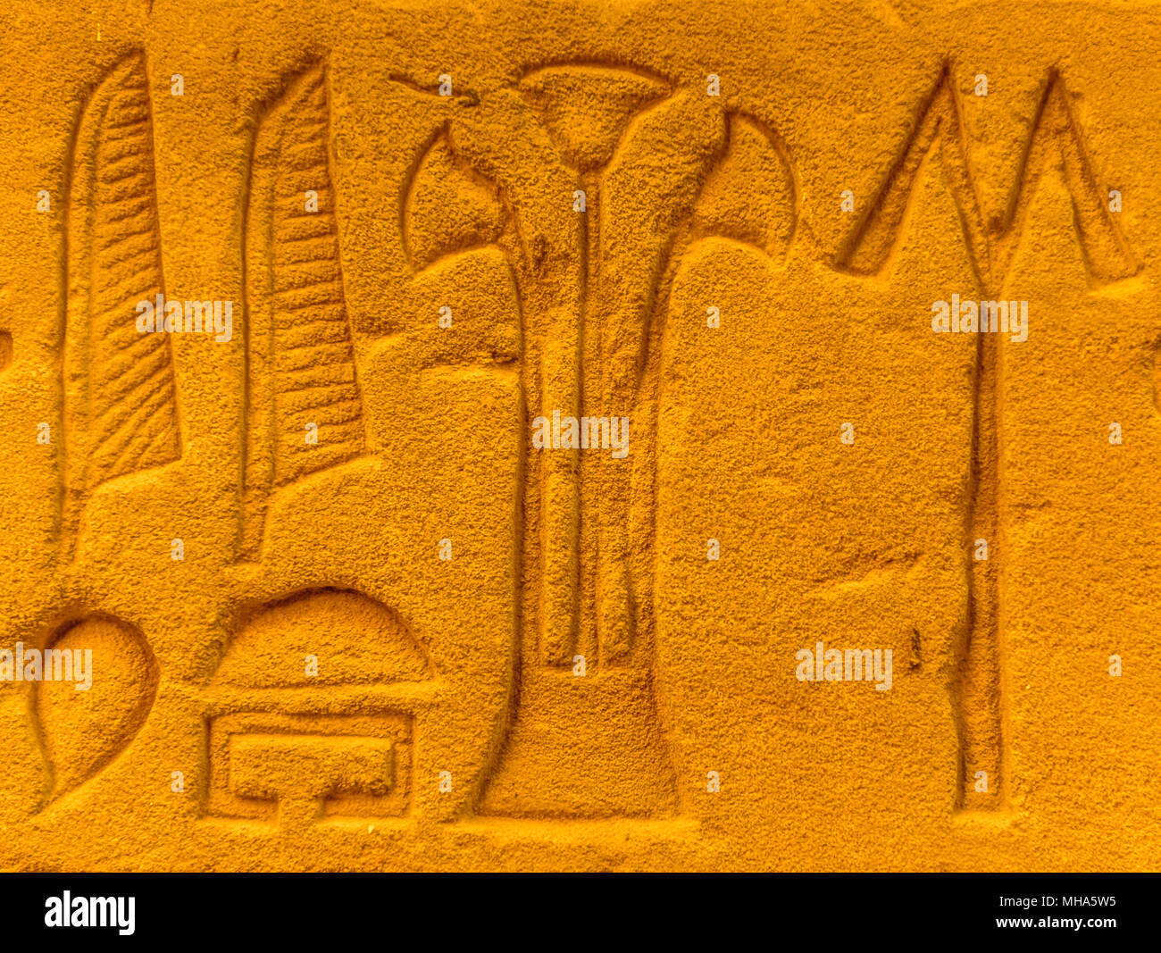 Egyptian hieroglyphs on the wall in a temple Stock Photo - Alamy