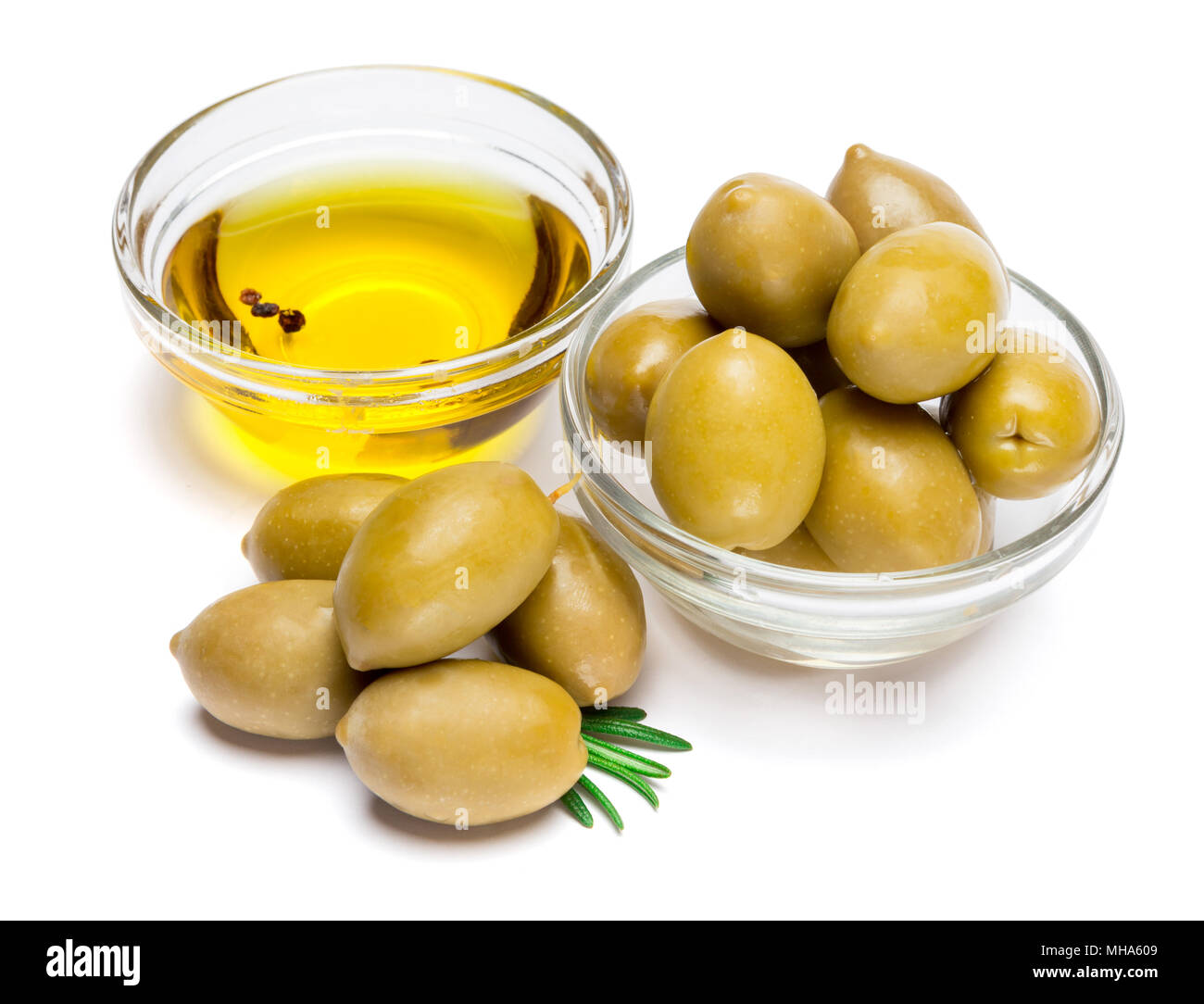 green olives ond olive oil isolated on white background Stock Photo - Alamy