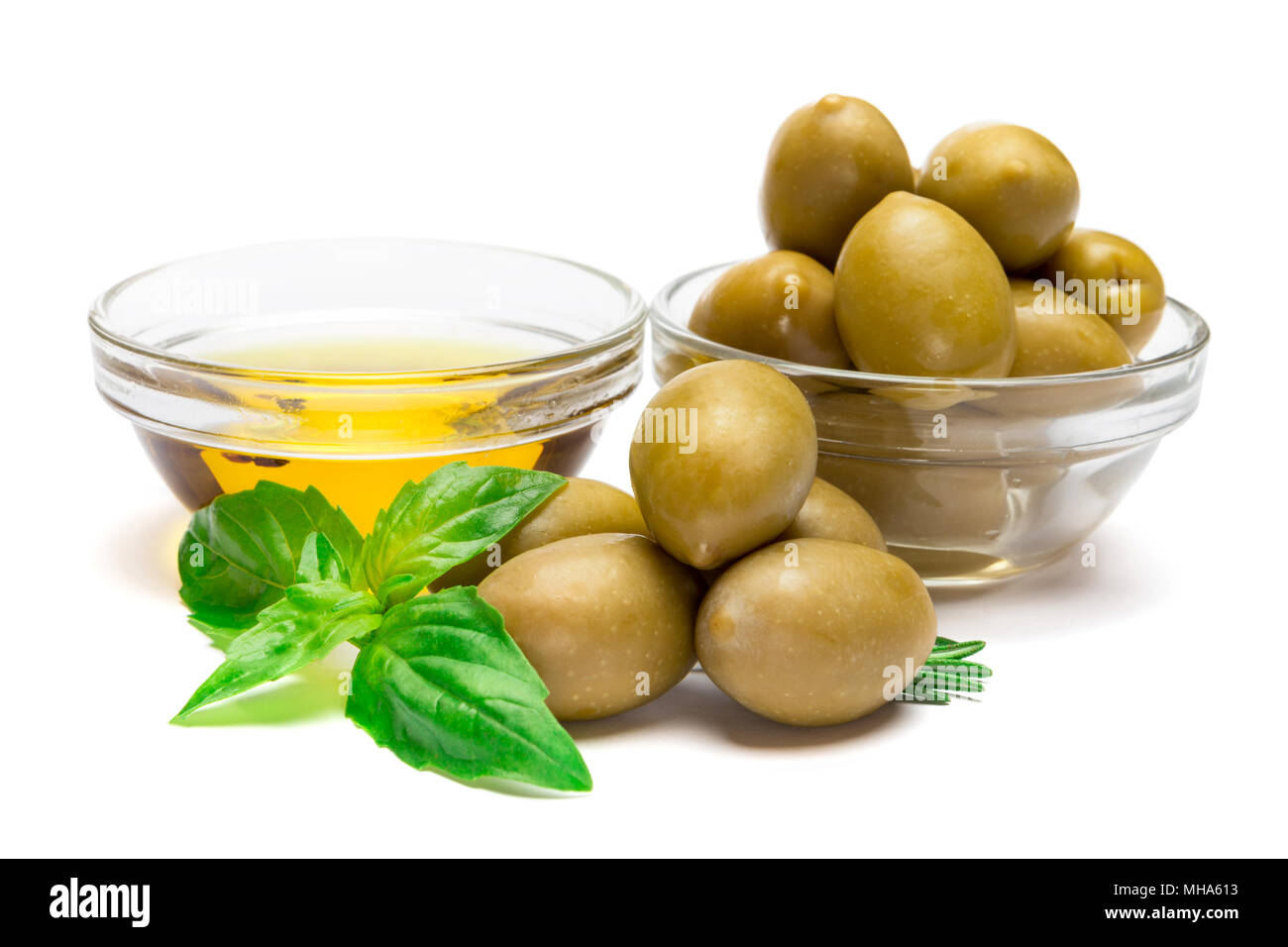 green olives ond olive oil isolated on white background Stock Photo - Alamy