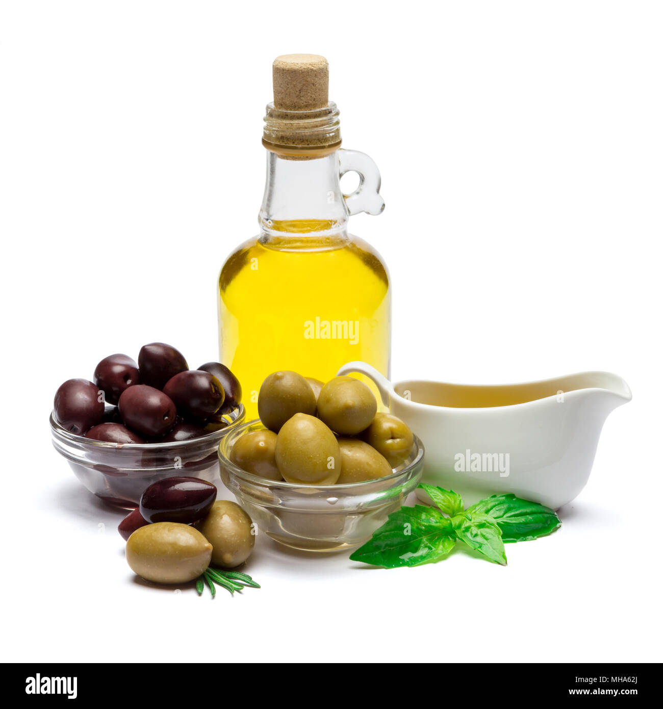 green olives ond olive oil isolated on white background Stock Photo - Alamy