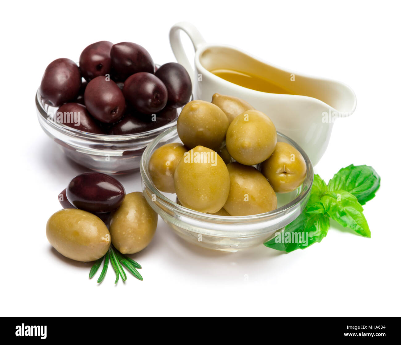 green olives ond olive oil isolated on white background Stock Photo - Alamy