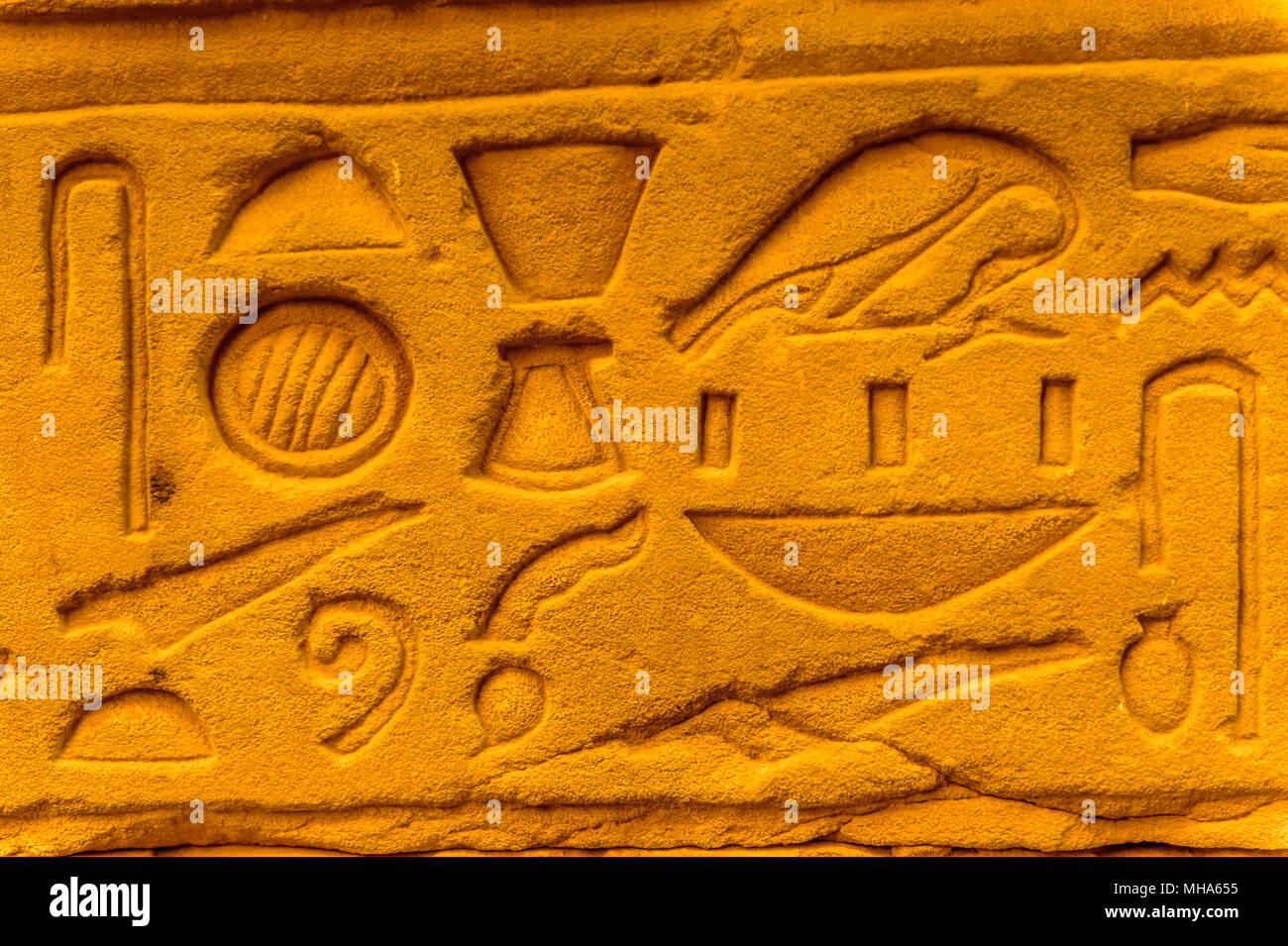 Egyptian hieroglyphs on the wall in a temple Stock Photo - Alamy