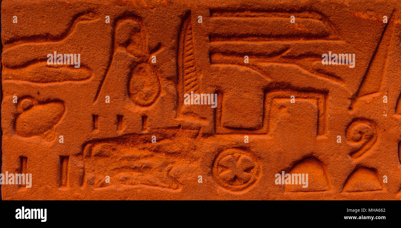 Egyptian hieroglyphs on the wall in a temple Stock Photo - Alamy