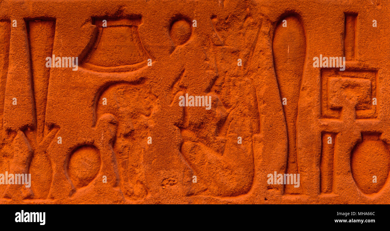Egyptian hieroglyphs on the wall in a temple Stock Photo - Alamy