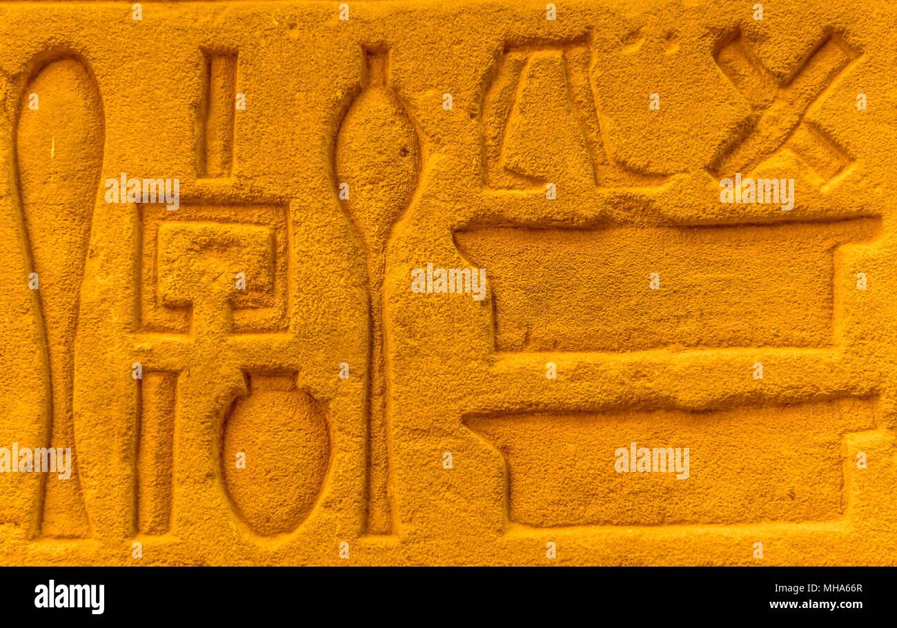 Egyptian hieroglyphs on the wall in a temple Stock Photo - Alamy