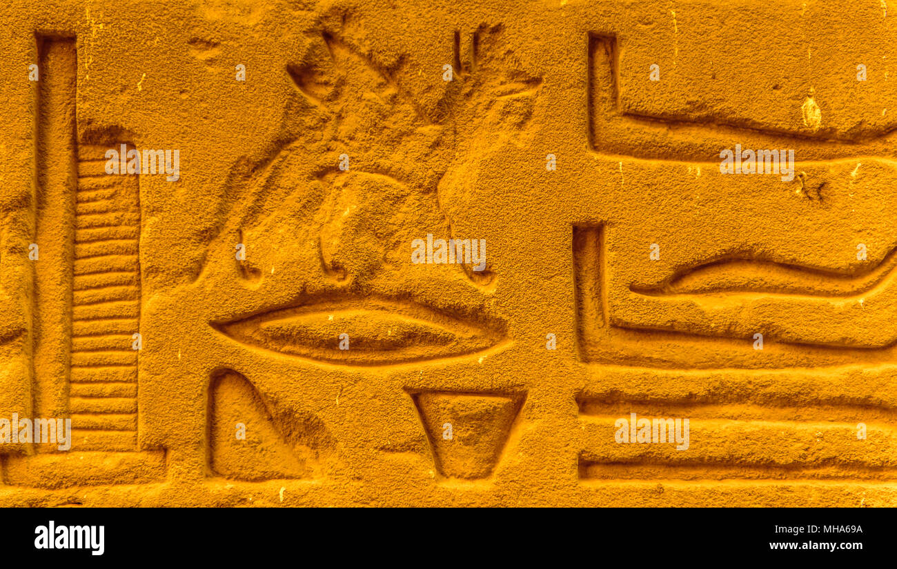 Egyptian hieroglyphs on the wall in a temple Stock Photo - Alamy