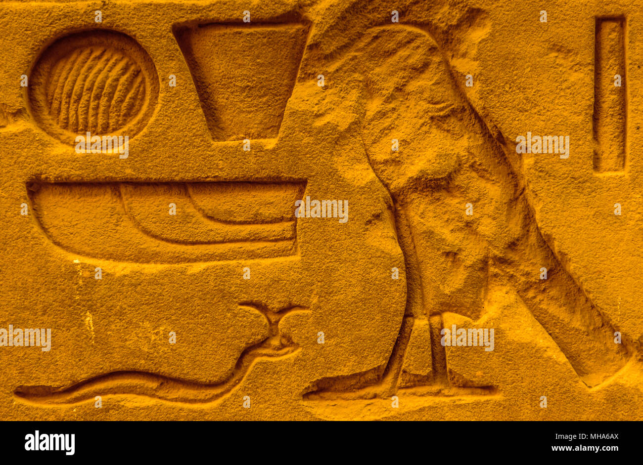 Egyptian hieroglyphs on the wall in a temple Stock Photo - Alamy