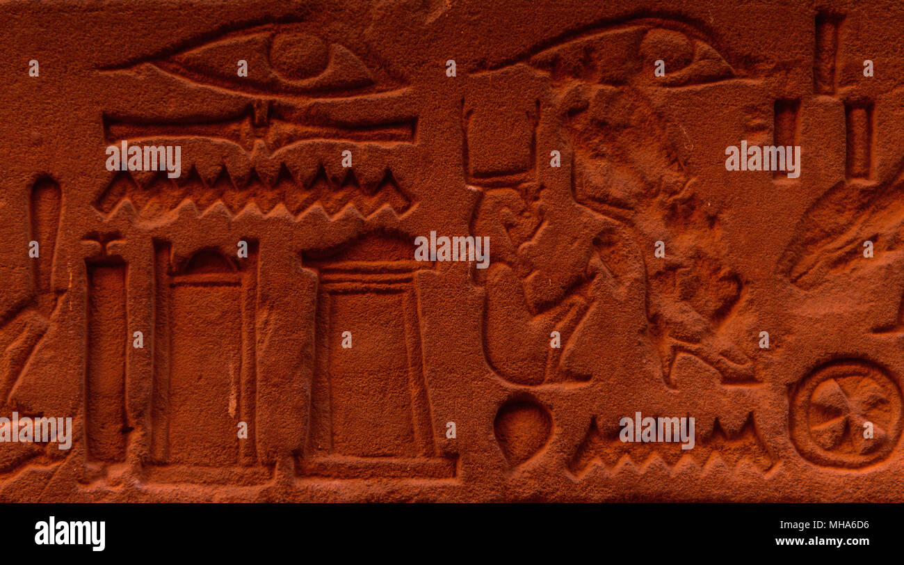 Egyptian hieroglyphs on the wall in a temple Stock Photo - Alamy
