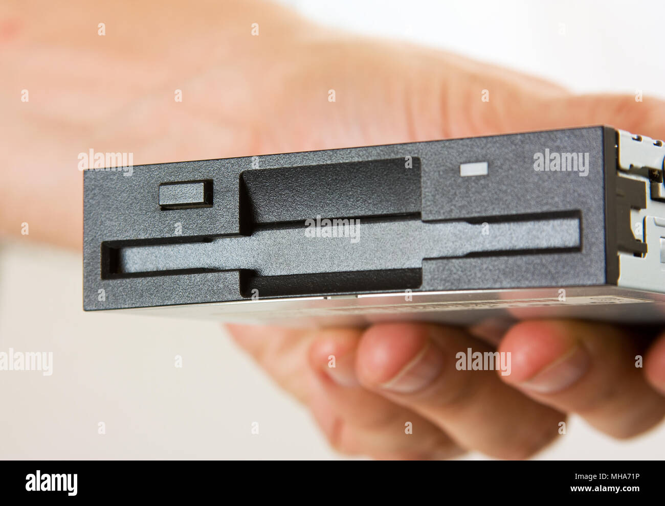 floppy disk drive in hand Stock Photo Alamy
