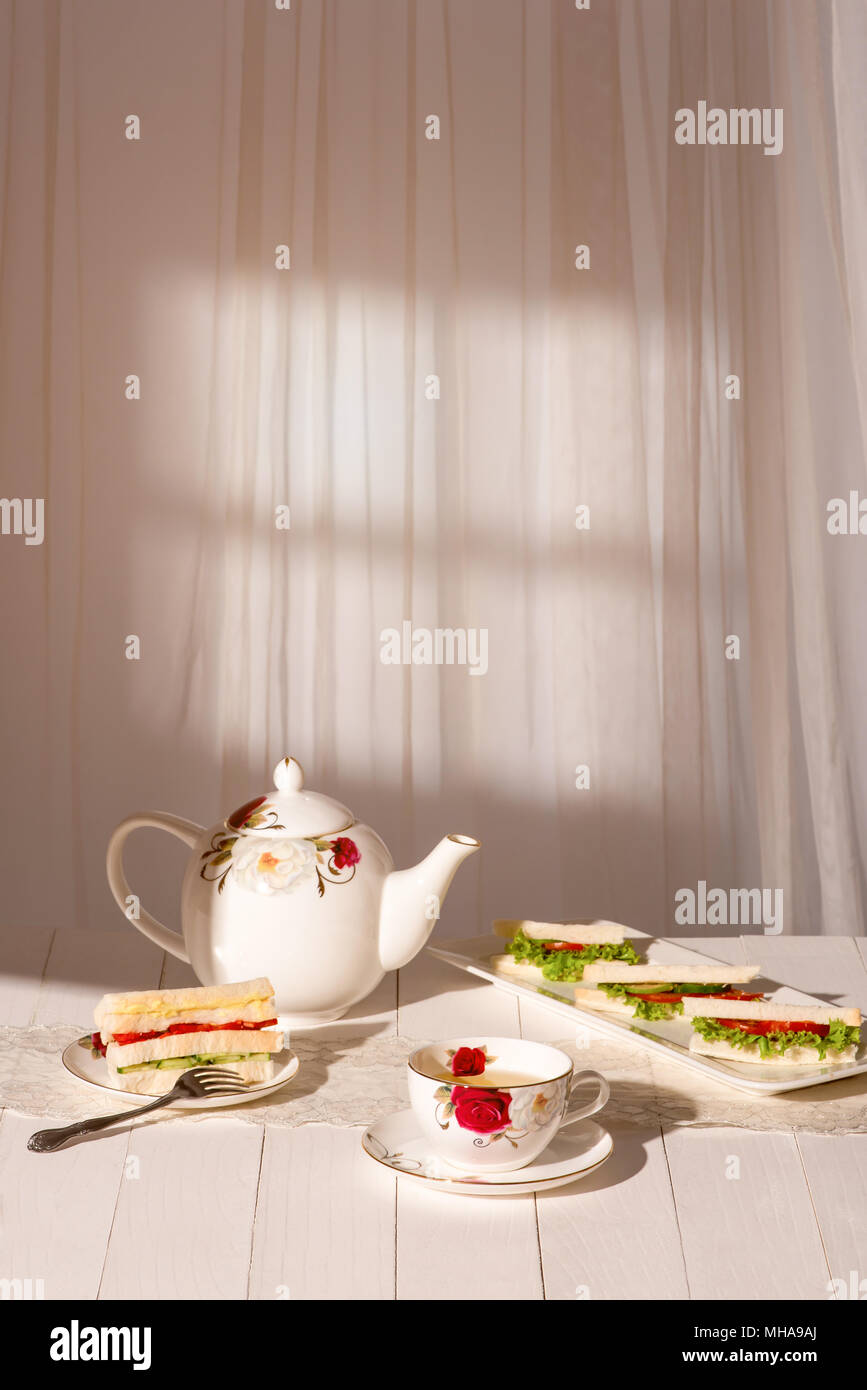 Afternoon tea table. tea set with sandwiches Stock Photo