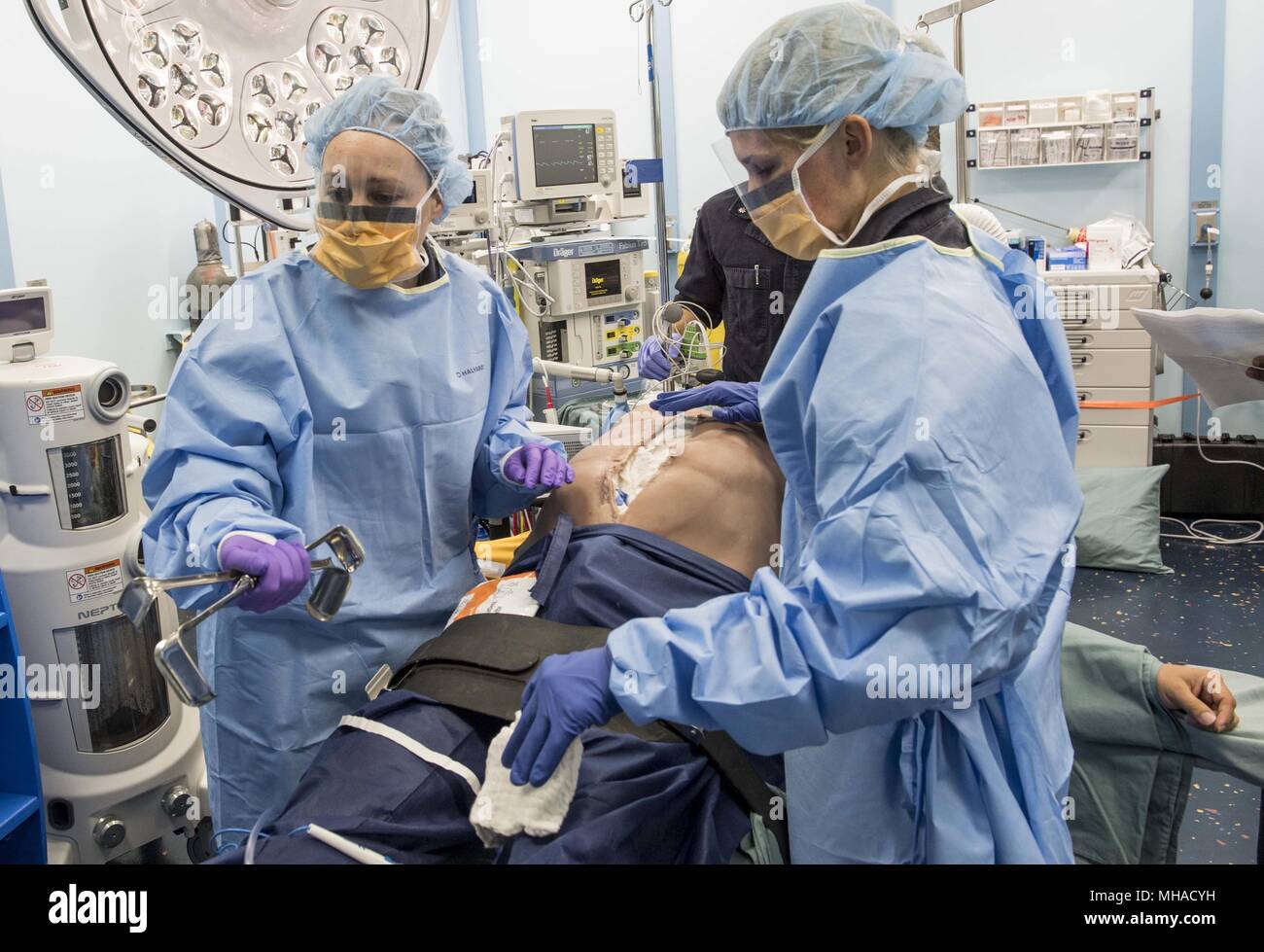 180423-N-RM689-0005 PACIFIC OCEAN (April 23, 2018) Surgeons aboard Military Sealift Command hospital ship USNS Mercy (T-AH 19) practice surgical techniques on a mock patient during a mass casualty drill, April 23, 2018. Mercy is currently deployed in support of Pacific Partnership 2018 (PP18). PP18's mission is to work collectively with host and partner nations to enhance regional interoperability and disaster response capabilities, increase stability and security in the region, and foster new and enduring friendships across the Indo-Pacific Region. Pacific Partnership, now in its 13th iterati Stock Photo