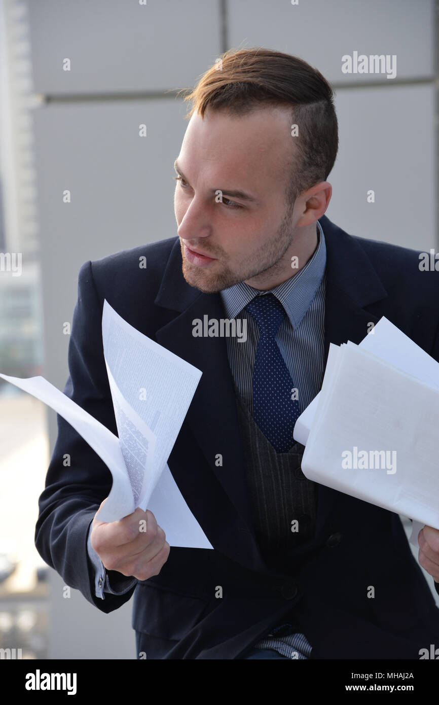 businessman emotionally reading documents Stock Photo