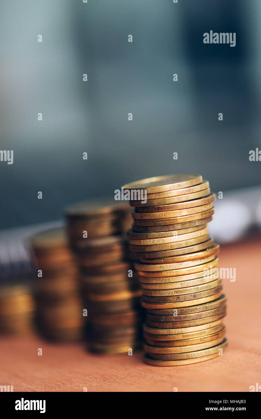 Coin stack on office desk, close up with selective focus Stock Photo