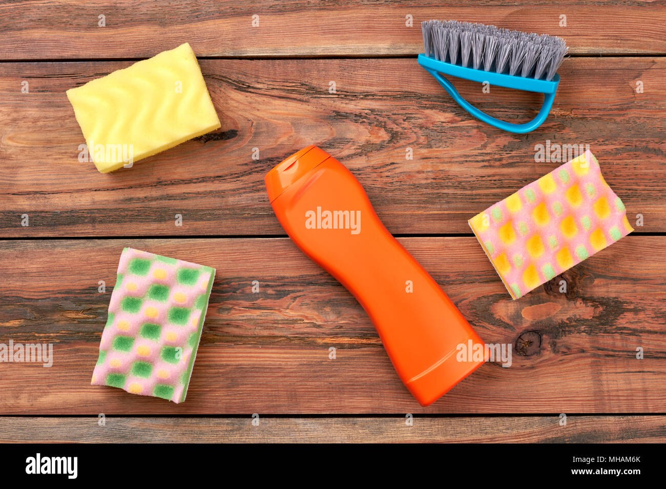 House cleaning products on wooden background. Stock Photo