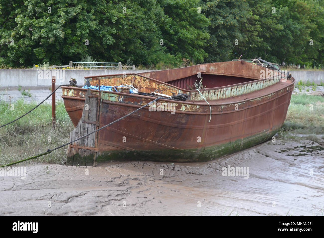 An image of a long forgotten boat that has now rusted Stock Photo
