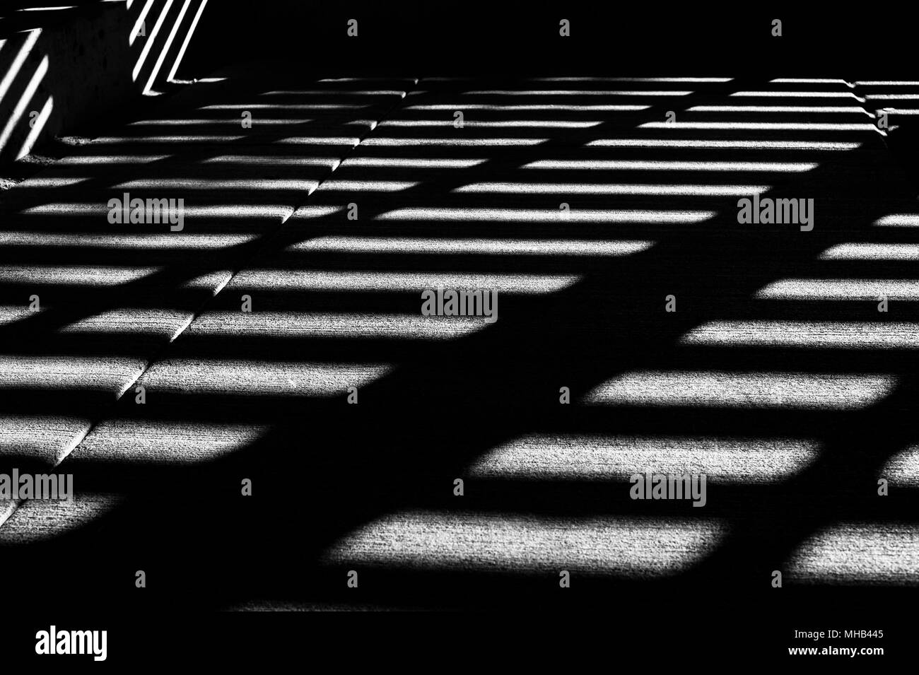 Storage room interior with light patterns creating geometric shapes