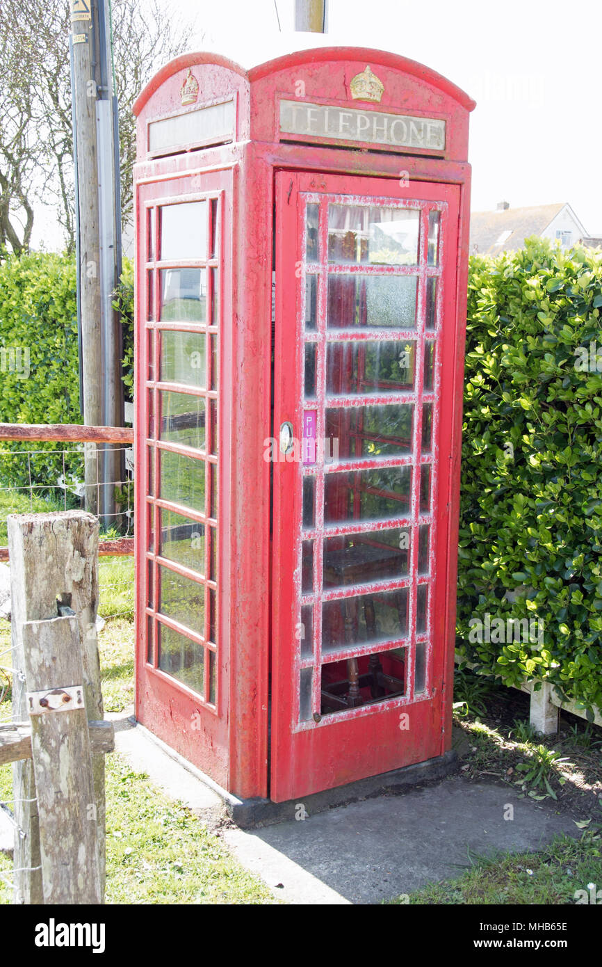 A traditional British red telephone box in Normans Bay, Sussex, UK