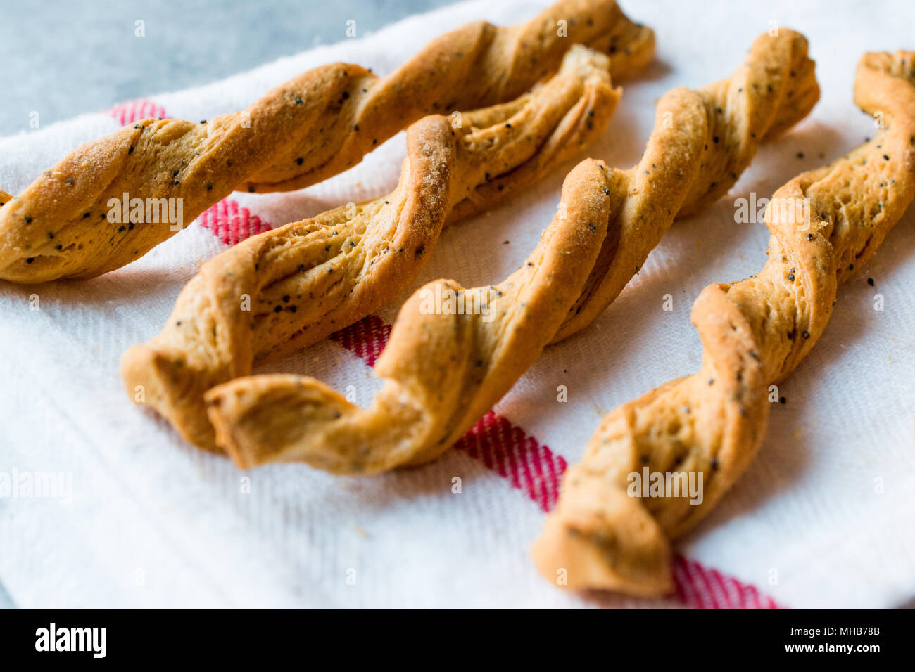 Mille Feuille Twisted Bread Stick Crackers with Spices, Tomato Flavor and Black Sesame or Cumins. Organic Food. Stock Photo