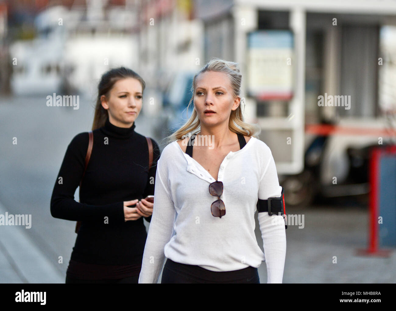 Women walking down Strandvägen street, Stockholm, Sweden Stock Photo