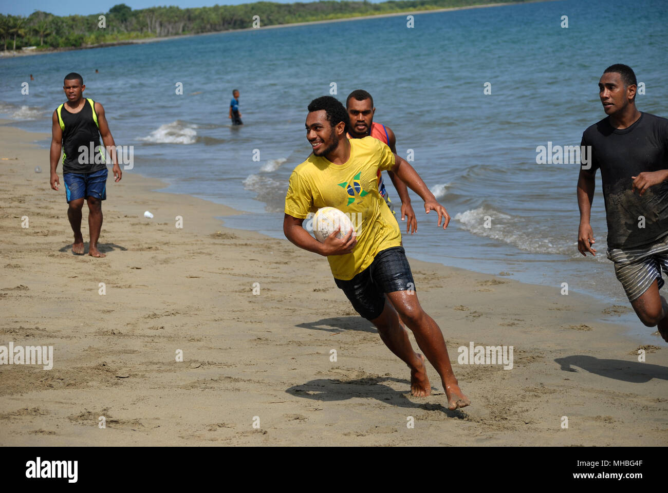 Fijian men playing rugby on Palm Beach, Pacific Harbour, Fiji Stock ...